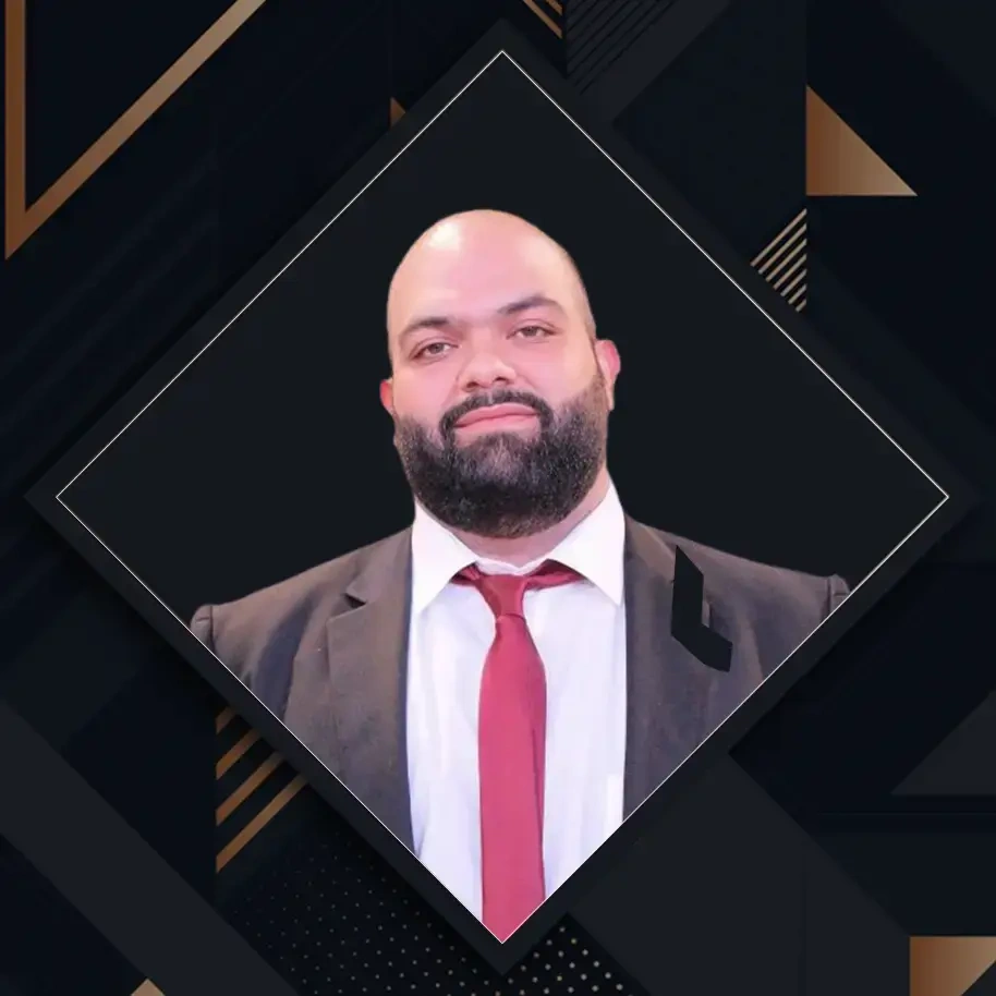 Moe Al Lakkis, Job Ad Marketing Hiring Specialist, wearing a suit and tie, smiling against a dark geometric background.